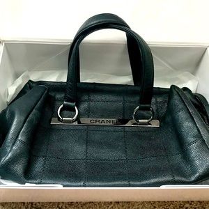 Authentic Chanel Black leather patchwork bag with authenticity card.